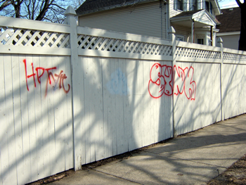 Graffiti on a fence on Spring Street.