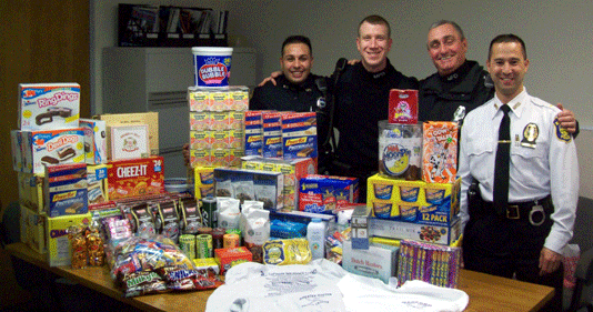 police officers with care package items for troops