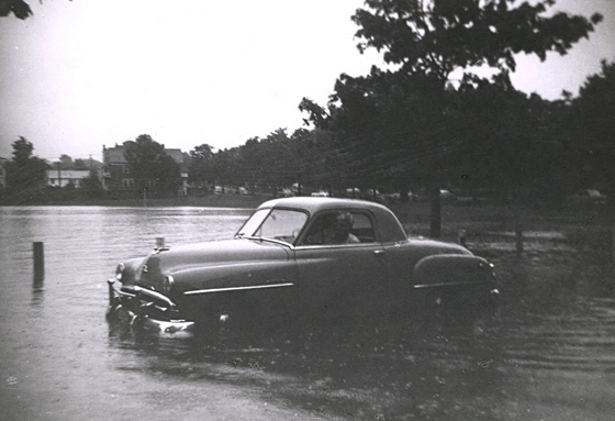 New car in water, Park Street, 1953