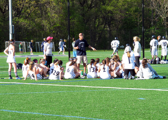 Coach Galusi and girls lacrosse team