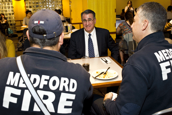 Tufts president with Medford firefighters